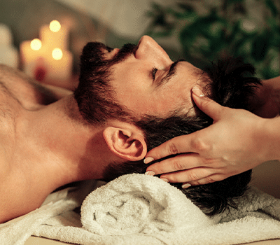 a man lying on a bed