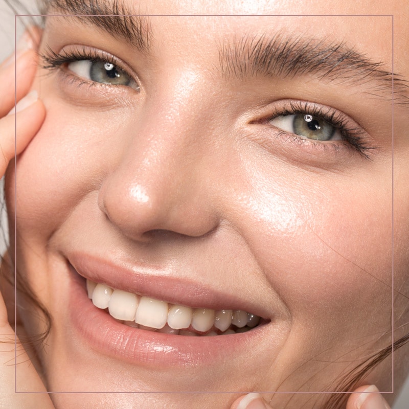a close up of a woman with blue eyes