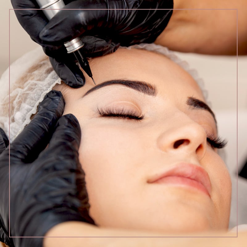 a close up of a woman lying down and looking at the camera